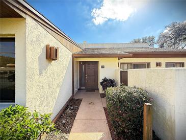 Inviting front entrance with a well-maintained walkway and tidy landscaping at 1880 N Crystal Lake Dr # 28, Lakeland, FL 33801