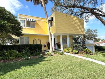 Striking two-story home with unique architectural details and lush landscaping at 2015 E Beacon By Way, Lakeland, FL 33803