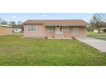 Charming single-story home with a well-maintained lawn and inviting front entrance at 2305 State Road 33 Hwy, Clermont, FL 34714