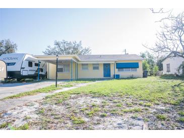 Charming single-story home featuring a covered carport and RV Parking, surrounded by a well-maintained lawn at 526 Hampton Ave, Lakeland, FL 33801