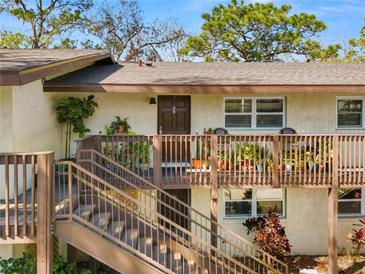 Inviting condo featuring a charming balcony adorned with plants, enhancing the exterior appeal at 141 Fernery Rd # C-6, Lakeland, FL 33809