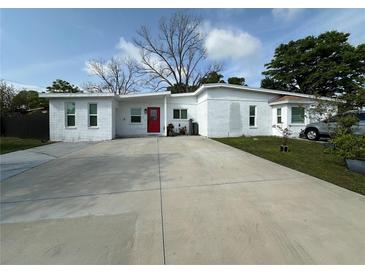 Charming one-story brick home with well-maintained landscaping and a spacious driveway at 1771 Bayview Dr, Lakeland, FL 33805