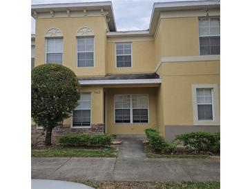 Charming two-story home with a well-maintained lawn and lush green shrubbery at 5407 Quarry Rock Rd, Lakeland, FL 33809