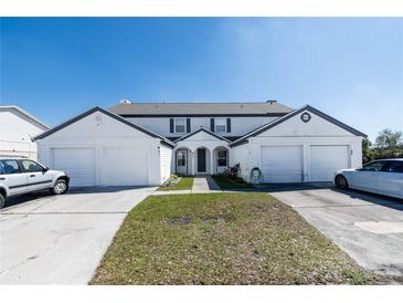 Charming townhouse with well-maintained lawn and attached garages at 1100 Lowry Ave # 51, Lakeland, FL 33801