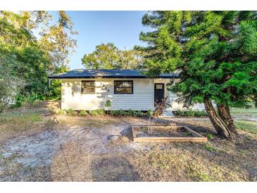 Charming single-story home featuring fresh paint, manicured landscaping, and a welcoming entrance at 5420 Ivory Ln, Lakeland, FL 33811