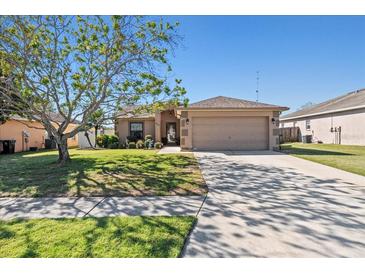 Charming single-story home with a well-maintained lawn and a two-car garage at 3137 Winchester Estates Loop, Lakeland, FL 33810