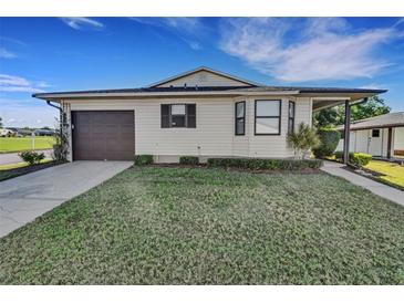 Charming single-story home with a well-manicured lawn and attached one-car garage at 3173 Sand Trap Ct, Lakeland, FL 33810