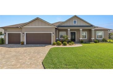 Charming single-story home featuring a well-manicured lawn and a spacious two car garage at 5020 Truman Ln, Lakeland, FL 33812