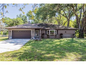 Charming single story home with a well-manicured lawn and attached two car garage at 530 Heather Ct, Bartow, FL 33830
