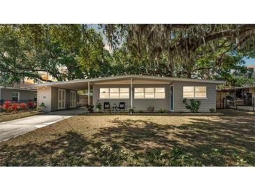 Charming single-story home with a spacious covered parking area and mature landscaping at 605 Forrest Dr, Bartow, FL 33830