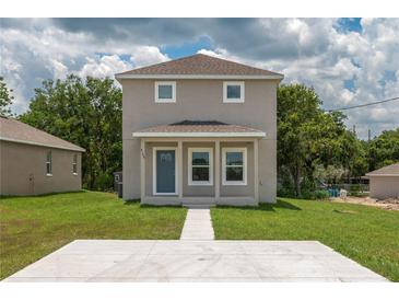 Inviting two-story home with a quaint covered porch and well-maintained front lawn at 4189 Radford Rd, Bartow, FL 33830