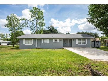 Charming single-story home with a well-maintained lawn and classic curb appeal at 4215 Sunnyside Dr, Lakeland, FL 33810