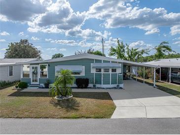 Charming single-story home with a covered carport and well-maintained landscaping at 5016 Forest Crest Dr, Lakeland, FL 33810