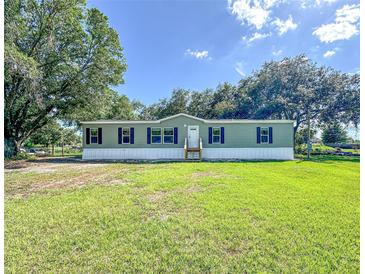 Charming single-story home featuring a well-maintained lawn and traditional architecture at 5248 Rock Dove Trl, Lakeland, FL 33810