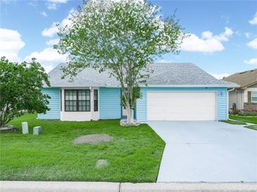 Charming one-story home featuring a spacious front yard and an attached two-car garage at 537 Eagle Run, Lakeland, FL 33809