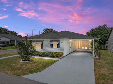 Charming single-story home featuring a covered carport and well-maintained landscaping at 4965 Goldenview Ln, Lakeland, FL 33811