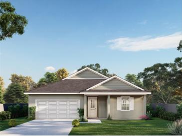 Charming single-story home featuring a covered entry, attached garage, and landscaped front yard at 0 Eagle Lake Loop Rd, Eagle Lake, FL 33839