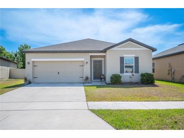 Charming single-Gathering home with a two-car garage and well-maintained landscaping at 5534 Turkey Creek Way, Lakeland, FL 33811