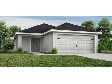 Charming single-story home with a two-car garage and neutral paint scheme, blending seamlessly with the surrounding landscape at 2206 Oldham Ct, Haines City, FL 33844