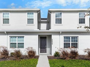 Charming two-story home featuring low-maintenance landscaping and a welcoming front door at 5776 Freshwater Canyon Dr, St Cloud, FL 34771