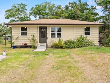 Charming single-story home featuring a well-maintained lawn and inviting front entrance at 209 W Crescent Dr, Lakeland, FL 33805