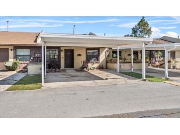 Charming home featuring a covered carport, offering shade and protection for your vehicle at 2173 Castle Pt, Winter Haven, FL 33880