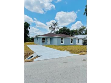 Charming single-story home with a long driveway and newly landscaped front yard at 2220 W Lanier St, Lakeland, FL 33815