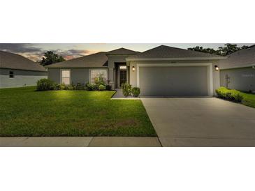 Charming single-story home with well-maintained lawn and attached two-car garage at 4582 Penkert Pl, Lakeland, FL 33811