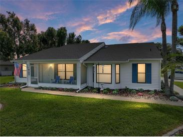 Charming single-story home with screened porch, manicured lawn, and mature landscaping providing excellent curb appeal at 6194 Sanderling Dr, Lakeland, FL 33809
