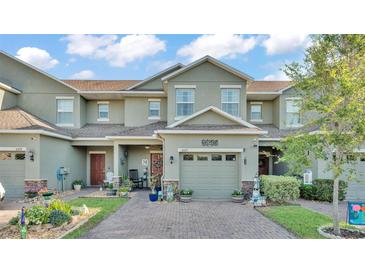 Charming two-story townhome features a one car garage and lovely landscaping at 6435 Sedgeford Dr, Lakeland, FL 33811