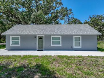 Charming single-story home featuring a gray exterior, a new gray roof, and manicured landscaping at 1415 Southern Ave, Lakeland, FL 33803