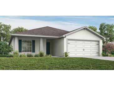Charming single-story home with a well-manicured lawn, two-car garage, and inviting entrance at 1814 Daystar Dr, Haines City, FL 33844
