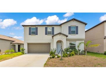 Charming two-story home featuring a neutral color palette and well-maintained landscaping at 2546 Red Egret Dr, Bartow, FL 33830