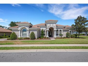 Stunning single-story home with a beautifully landscaped front yard and barrel tile roof at 6527 Eagle Ridge Way, Lakeland, FL 33813