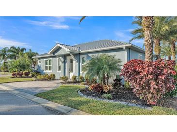 Charming single-story home with lush landscaping and well-maintained front yard at 3287 Red Tail Hawk Dr, Polk City, FL 33868