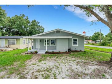 Charming single-story home features a covered front porch and updated landscaping, providing great curb appeal at 3601 Avenue R Nw, Winter Haven, FL 33881