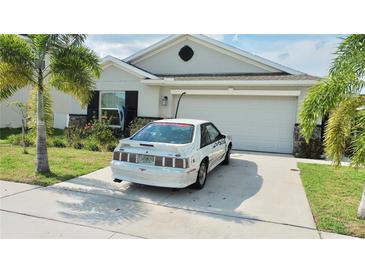 Charming single-story home with a well-maintained lawn and a two-car garage at 550 Patton Loop, Bartow, FL 33830