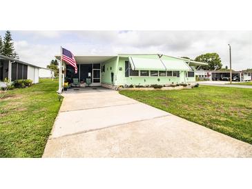 Charming single-story home with well-maintained lawn and a concrete driveway at 1610 Reynolds Rd # 204, Lakeland, FL 33801