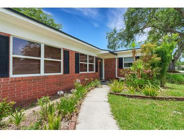 Charming brick home featuring manicured landscaping, a welcoming walkway, and a classic design at 2632 Handley Blvd, Lakeland, FL 33803