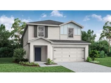 Charming two-story home with gray shingles, white siding, and manicured landscaping at 5317 Se 127Th Ln, Belleview, FL 34420