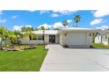 Charming single-story home featuring a well-manicured lawn, inviting entrance, and a convenient attached garage at 6 Rosewood Dr, Davenport, FL 33837