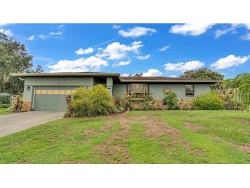 Charming single-story home featuring a well-maintained lawn and landscape, with an attached two car garage at 8535 Plantation Ridge Blvd, Lakeland, FL 33809