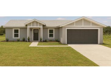 Charming single-story home featuring a well-manicured lawn, an attached garage, and a welcoming entrance at 200 Locust Pass, Ocala, FL 34472