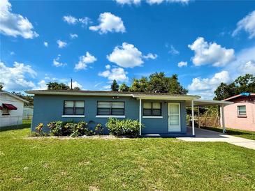 Charming single-story home with a covered carport, a well-maintained lawn and landscaping at 2655 Hempstead Dr, Lakeland, FL 33801