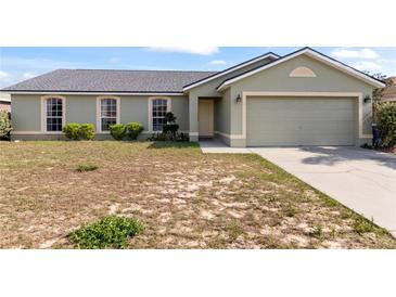 Charming single-Gathering home with a two-car garage and green lawn at 367 Cloverdale Rd, Winter Haven, FL 33884