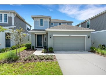Charming two-story home with well-maintained landscaping and a two-car garage at 6261 Great Bear Dr, Lakeland, FL 33805
