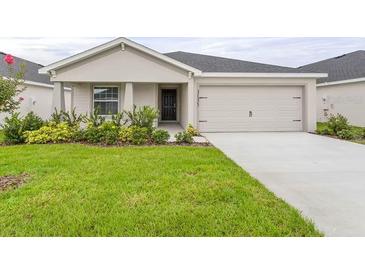 Charming single-story home with a well-maintained lawn and inviting curb appeal at 3135 Laurel Oak Ln, Winter Haven, FL 33884