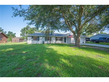 Charming single-story home with a well-maintained lawn and mature shade trees at 6507 Shadowbrook Run, Lakeland, FL 33813
