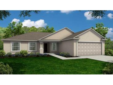 Charming one-story home with a well-manicured lawn and an attached garage at 35 Graner Dr, Frostproof, FL 33843