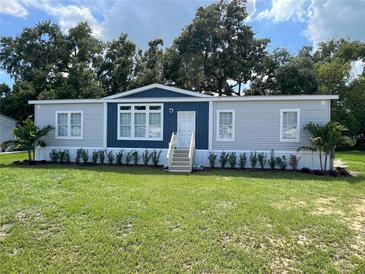 Charming single-story home featuring a well-manicured lawn and a welcoming front entrance at 3780 Pioneer Trails St, Lakeland, FL 33810